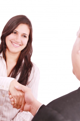 lady shaking hand after excelling in exploratory interview